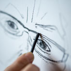 Lyn Carruthers making a self portrait in her studio in 2019